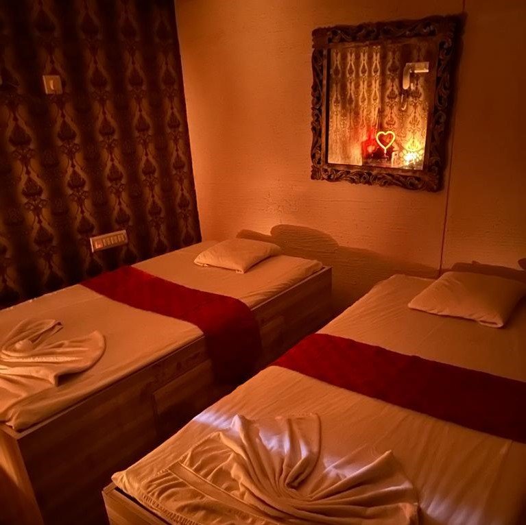 Therapist providing a relaxing spa treatment with essential oils at Spa Empire